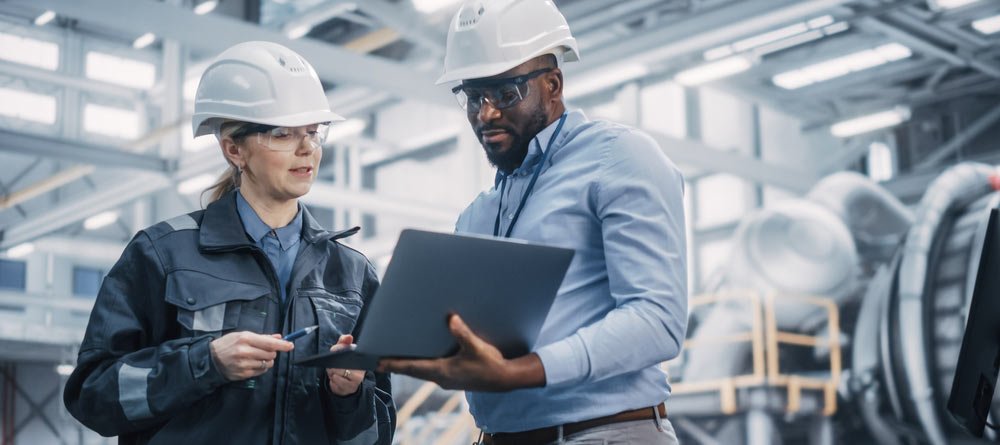 two employees are discussing workers compensation policies at work