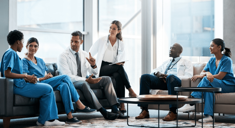 doctors & nurses are sitting in a hall and discussing healthcare insurance programs