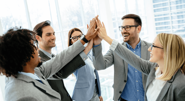 Colleagues are cheering the showing unity and giving high-fives