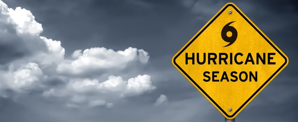 The Clouds are black and a warning board says hurricane season