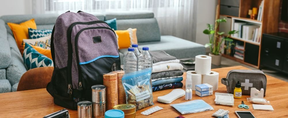 Bag, water bottle, meds, snacks and few essentials kept on the table.